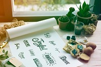 Painting paper words icons design cactus plants on a wooden table