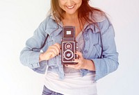 Woman photographer holding camera and focusing
