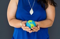 Woman holding global ball in her hands