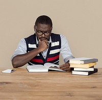 African Man Curious Thinking Reading Book Studio Portrait