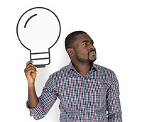 African Descent man holding light bulb