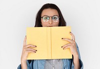 A girl with eyeglasses holding book