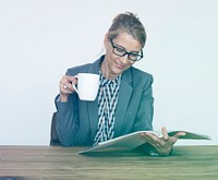 Office Worker Drinking Coffee Reading Book