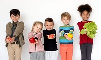 Kids holding vegetables