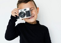 Cute little boy with a camera