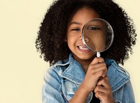 Little Girl Holding Magnifying Glass Smiling