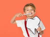 Little Boy Brushing Teeth Holding Papercraft Tooth