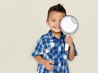 Boy using a paper magnifying glass