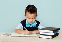 A Caucasian Boy Studying Writing Background Studio Portrait