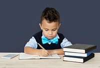 A Caucasian Boy Studying Writing Background Studio Portrait