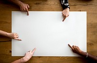 Hands pointing to a blank paper on the table