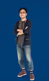 Full body portrait of an Asian man with arms crossed
