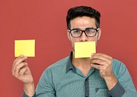 A man with post-it on his mouth