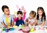 Group of kids painting Easter eggs