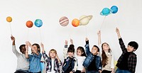 Group of Kids Holding Papercraft Galaxy Symbol on White Blackground