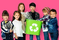 Kids and plastic bottles in a recycle bin