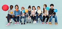 Diverse group of kids holding planets on sticks isolated background