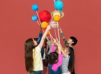 Diverse group of kids holding planets on sticks isolated background