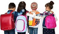 Rear view group of diverse kids wearing backpack