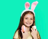 Children with bunny hairband and easter eggs