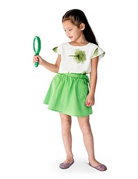 A girl is holding green magnifier