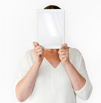 Woman holding blank digital tablet cover face studio portrait