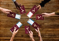 Group of Diverse Friendship Hands Show Passport with Plane Ticket