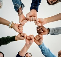 Diverse People Hands Fists Together Partnership