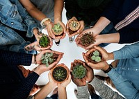 People holding plants in their hands