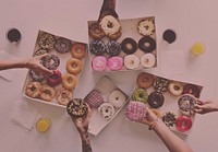 Diversity People Hands Reach for Doughnuts