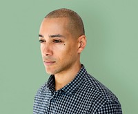 Skinhead man wearing checkered shirt studio shoot