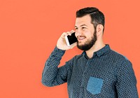 Man standing and using phone to pose for photoshoot