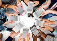 People holding mobiles and standing in circle