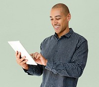 A guy is smiling using tablet