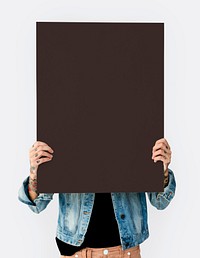 Woman holding blank banner cover face studio portrait