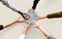 Group of Hands reaching for a donut