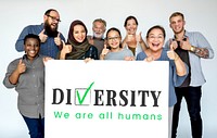 Group of diverse people with diversity poster