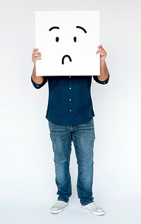 Man standing and holding banner