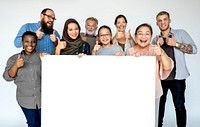 Diverse group of people smiling and holding blank banner