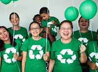 Ecology group of people smiling and holding balloons