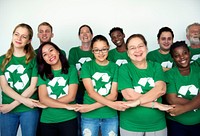 People in group wearing recycle icon shirts and posing for photoshoot