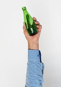 Hand holding bottle of glass
