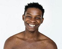 Man standing topless and posing for photoshoot