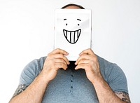 Man Face Covered with Digital Tablet