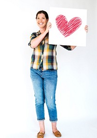 People Hands Holding Heart on Paper Board Studio Portrait