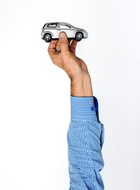 Hand showing a car toy