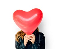 Young Adult Woman Face Covered with Heart Balloon