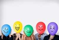 Group of Diverse People Faces Covered with Emotion Expression Balloons