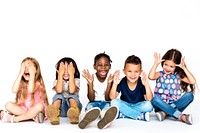 Diverse group of children doing peek a boo hand gesture