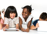 Group of kids using social networking devices